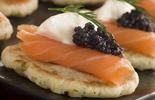 Norwegian smoked salmon blinis with crème fraiche and caviar